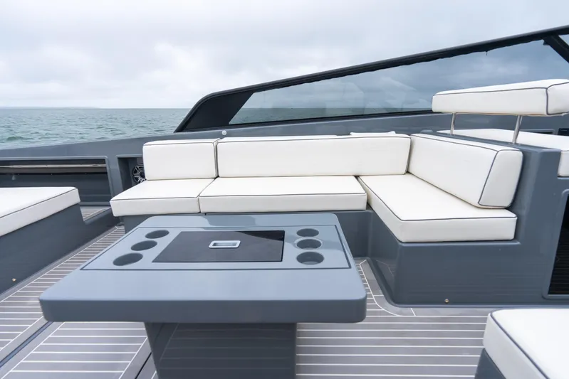 Brix Yacht Photos Pics Luxurious 2023 VanDutch 48 yacht with sleek seating and modern design on open water.