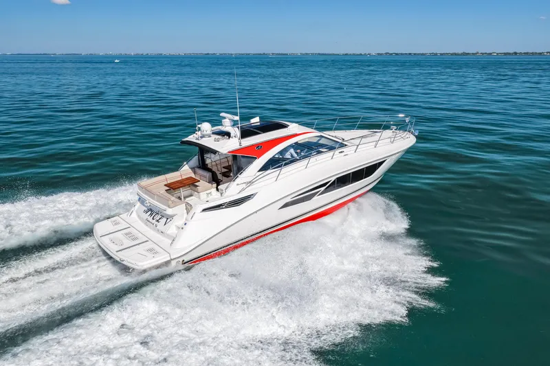  Yacht Photos Pics 2016 Sea Ray 510 Sundancer cruising on open water, showcasing sleek design and performance.