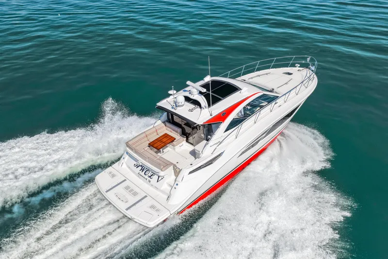  Yacht Photos Pics 2016 Sea Ray 510 Sundancer cruising on open water, showcasing sleek design and performance.