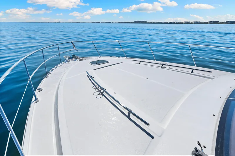  Yacht Photos Pics 2016 Sea Ray 510 Sundancer yacht on calm blue waters under a clear sky.