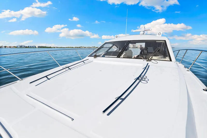  Yacht Photos Pics 2016 Sea Ray 510 Sundancer yacht on calm water under blue sky.
