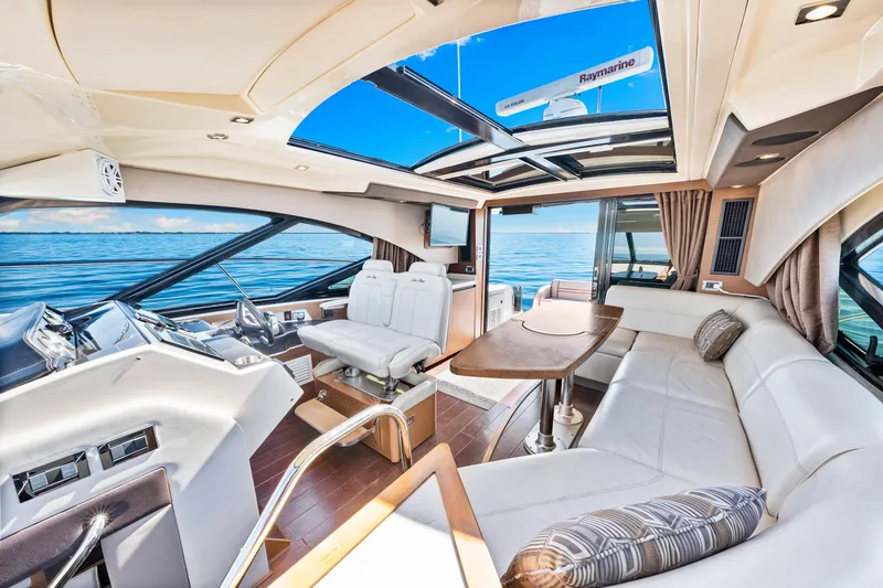  Yacht Photos Pics Luxurious interior of 2016 Sea Ray 510 Sundancer yacht with panoramic ocean view.
