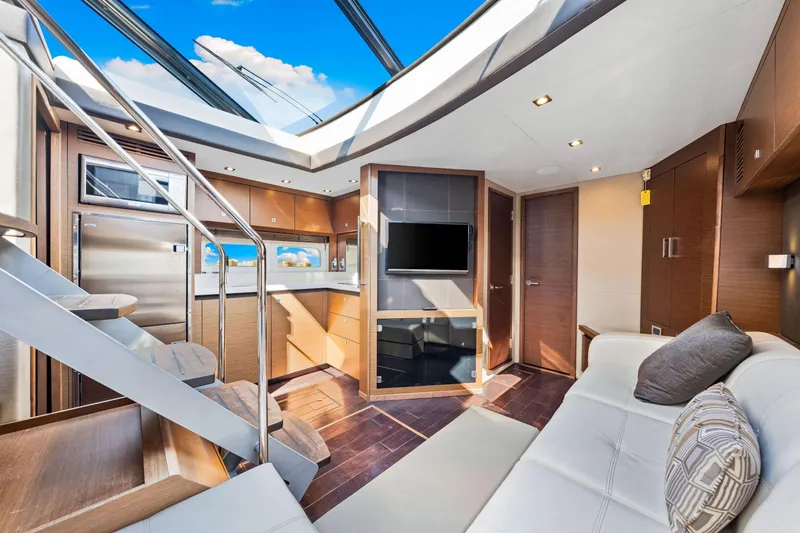  Yacht Photos Pics Luxurious interior of 2016 Sea Ray 510 Sundancer yacht with modern design and skylight.
