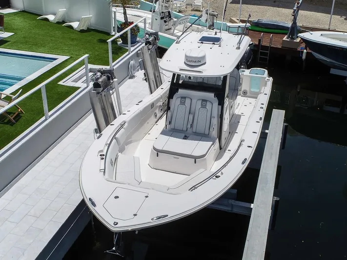  Yacht Photos Pics 2024 Sea Fox 328 Commander boat docked, showcasing sleek design and spacious deck.