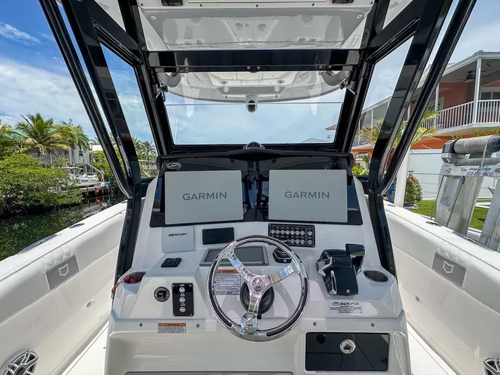  Yacht Photos Pics 2024 Sea Fox 328 Commander helm with Garmin displays and Mercury controls.