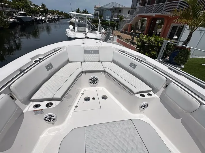  Yacht Photos Pics 2024 Sea Fox 328 Commander boat interior with luxurious seating and modern design.