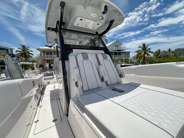  Yacht Photos Pics 2024 Sea Fox 328 Commander boat interior with luxurious seating and modern design.