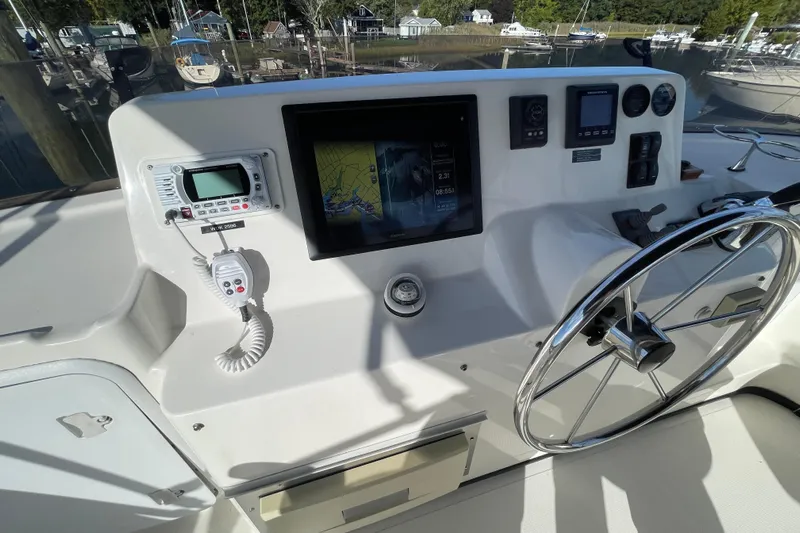 Yacht Photos Pics 2015 Nordic Tug 39 helm with navigation equipment and steering wheel.