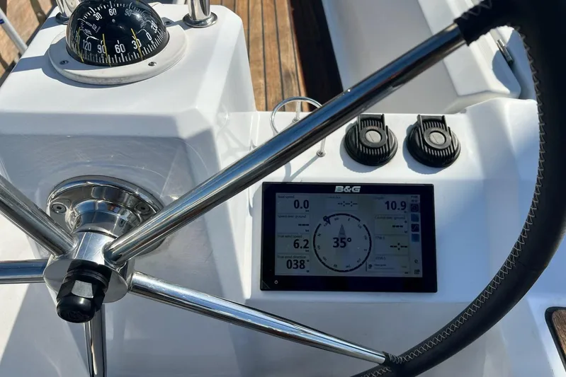 Toofun Yacht Photos Pics Steering wheel and navigation display on 2016 Beneteau Oceanis 38 sailboat.