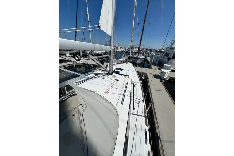 Toofun Yacht Photos Pics 2016 Beneteau Oceanis 38 sailboat docked at marina under clear blue sky.
