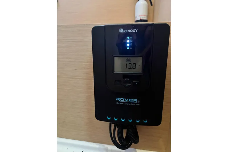 Toofun Yacht Photos Pics Renogy Rover 40A MPPT charge controller displaying 13.8V on a Beneteau Oceanis 38 yacht.