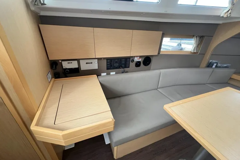 Toofun Yacht Photos Pics Interior of 2016 Beneteau Oceanis 38 yacht with modern seating and navigation equipment.