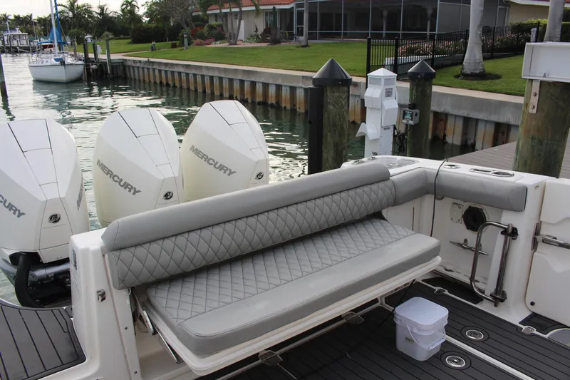  Yacht Photos Pics 2020 Boston Whaler 350 Outrage with Mercury engines, docked with luxurious seating.