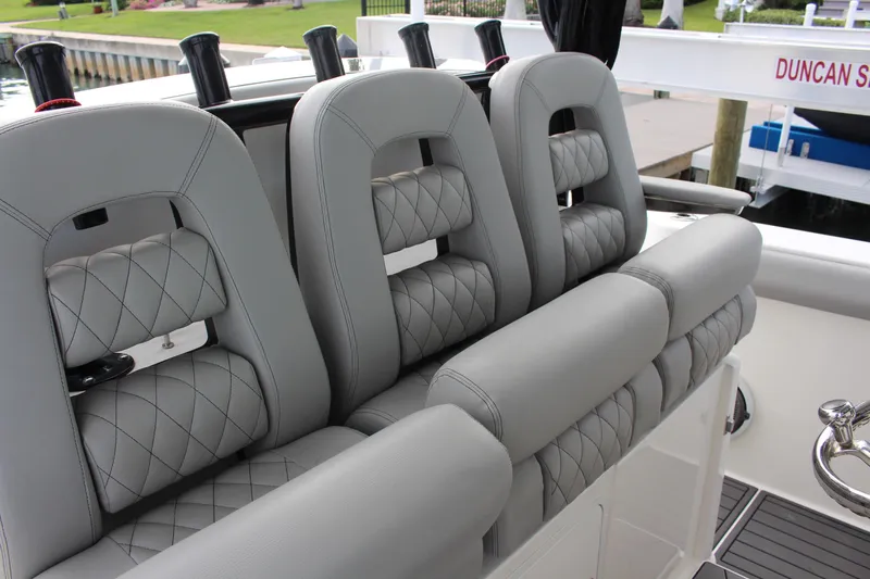  Yacht Photos Pics Luxurious seating on 2020 Boston Whaler 350 Outrage boat with quilted gray upholstery.