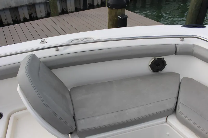  Yacht Photos Pics 2020 Boston Whaler 350 Outrage boat seating area with gray cushions and speaker.