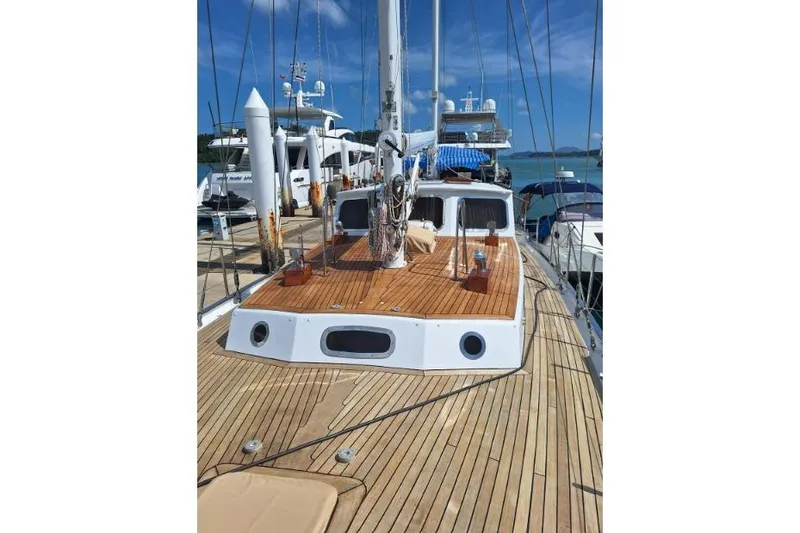  Yacht Photos Pics Sailboat deck view, Don Brooke 77, 1987 model, docked at marina under clear blue sky.