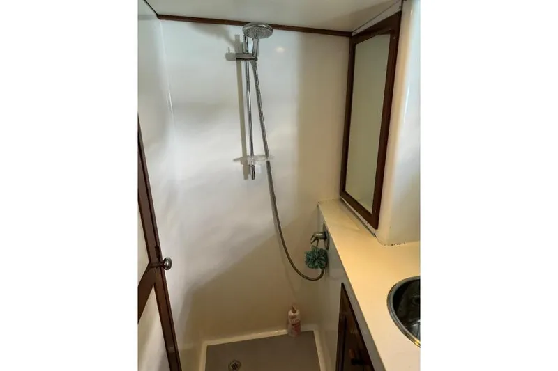  Yacht Photos Pics Compact shower area in a 1987 Don Brooke 77 yacht bathroom.
