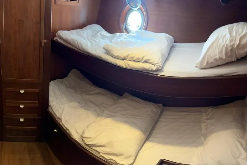  Yacht Photos Pics Cozy wooden bunk beds in a 1987 Don Brooke 77 yacht cabin.