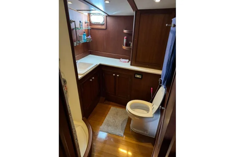  Yacht Photos Pics Luxurious wooden bathroom interior on a 1987 Don Brooke 77 yacht.