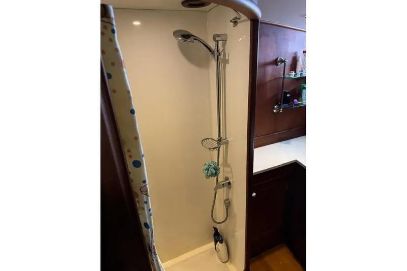  Yacht Photos Pics Shower area in a 1987 Don Brooke 77 yacht with modern fixtures.