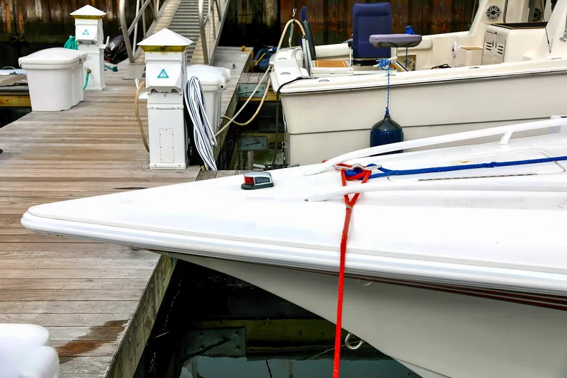  Yacht Photos Pics Fountain Lightning 42 boat docked at marina, 2001 model.