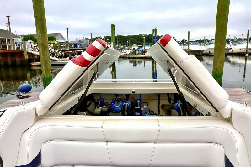  Yacht Photos Pics Open engine compartment of 2001 Fountain Lightning 42 boat at marina.