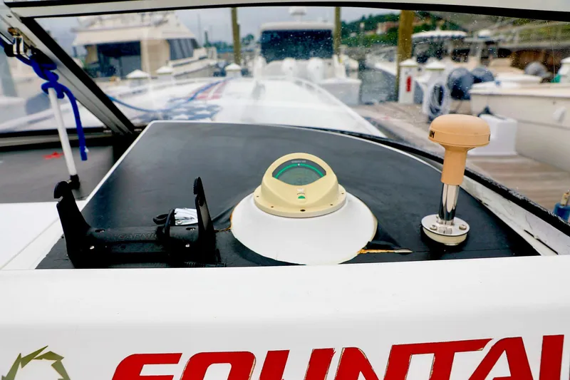  Yacht Photos Pics Dashboard of 2001 Fountain Lightning 42 speedboat at marina.