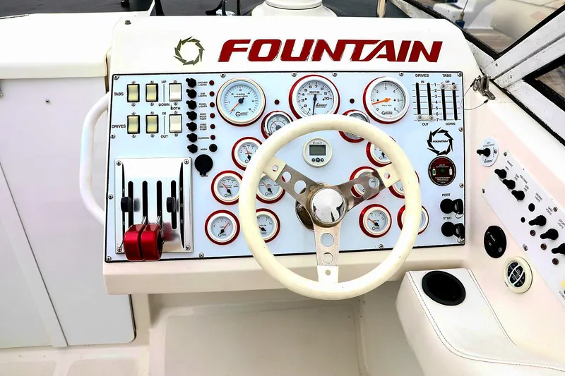  Yacht Photos Pics Dashboard of a 2001 Fountain Lightning 42 boat with gauges and controls.