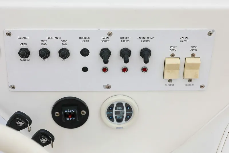  Yacht Photos Pics Control panel of a 2001 Fountain Lightning 42 boat with various switches and indicators.