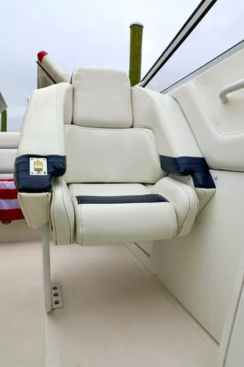  Yacht Photos Pics 2001 Fountain Lightning 42 boat seat with white and navy upholstery.