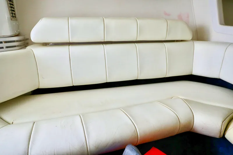  Yacht Photos Pics White leather seating in a 2001 Fountain Lightning 42 boat interior.