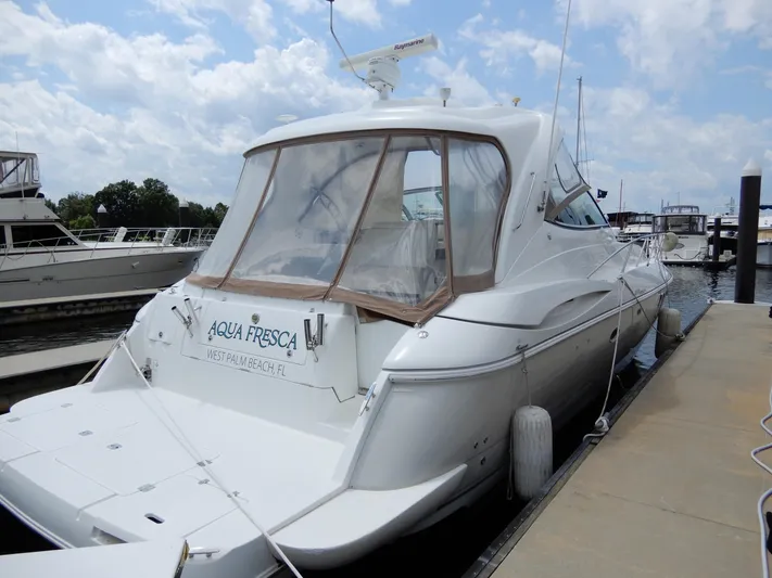  Yacht Photos Pics 2008 Cruisers Yachts 460 Express docked, featuring sleek design and spacious deck.