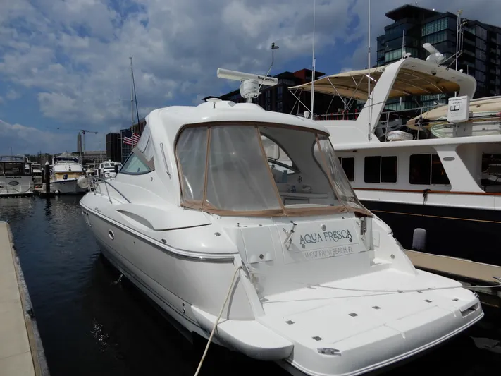  Yacht Photos Pics 2008 Cruisers Yachts 460 Express docked at marina under cloudy sky.