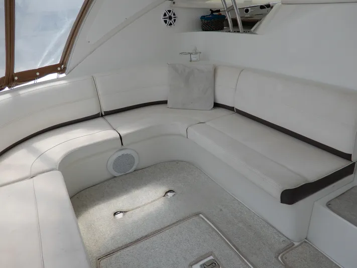  Yacht Photos Pics 2008 Cruisers Yachts 460 Express interior with white seating and carpeted floor.