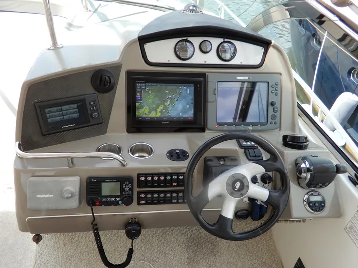  Yacht Photos Pics Helm of 2008 Cruisers Yachts 460 Express with navigation and control systems.