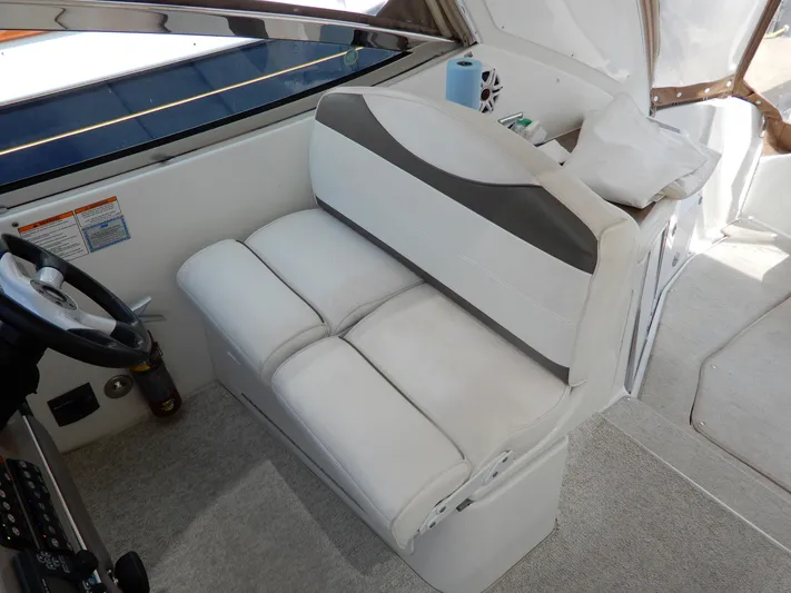  Yacht Photos Pics 2008 Cruisers Yachts 460 Express interior with white seating and steering wheel.