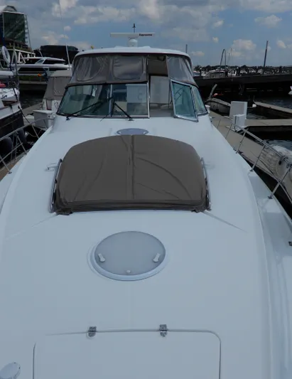  Yacht Photos Pics 2008 Cruisers Yachts 460 Express docked at marina, showcasing sleek design and spacious deck.