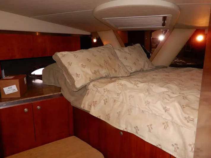  Yacht Photos Pics Luxurious cabin interior of 2008 Cruisers Yachts 460 Express with cozy bedding.