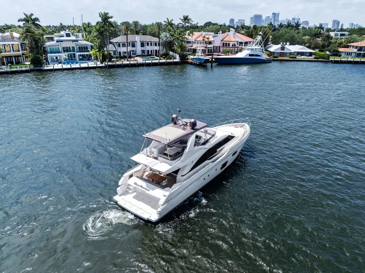 Blue Abalone Yacht Photos Pics 2015 Ferretti Yachts 690 cruising near waterfront homes.