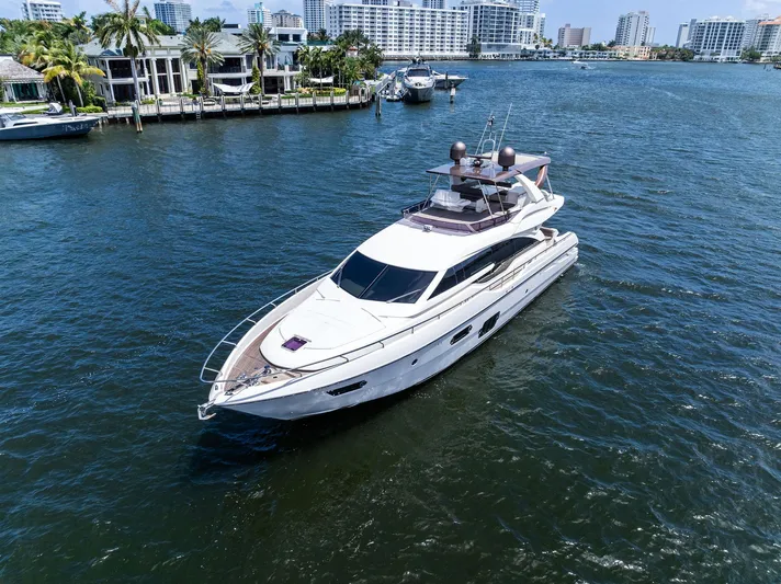 Blue Abalone Yacht Photos Pics Luxurious 2015 Ferretti Yachts 690 cruising in a scenic waterfront setting.