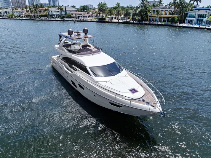 Blue Abalone Yacht Photos Pics 2015 Ferretti Yachts 690 cruising on a sunny day, surrounded by waterfront homes.
