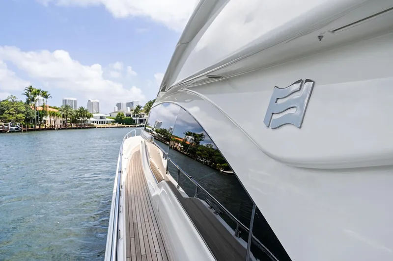 Blue Abalone Yacht Photos Pics 2015 Ferretti Yachts 690 cruising on a scenic waterway, showcasing sleek design and luxury.