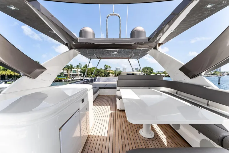 Blue Abalone Yacht Photos Pics Luxurious 2015 Ferretti Yachts 690 flybridge with sleek seating and dining area.
