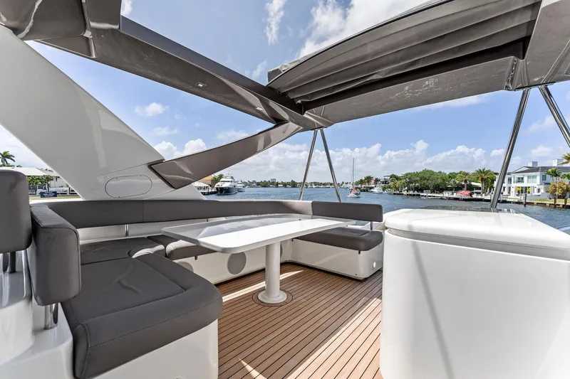 Blue Abalone Yacht Photos Pics Luxurious 2015 Ferretti Yachts 690 with spacious deck seating and scenic waterfront view.