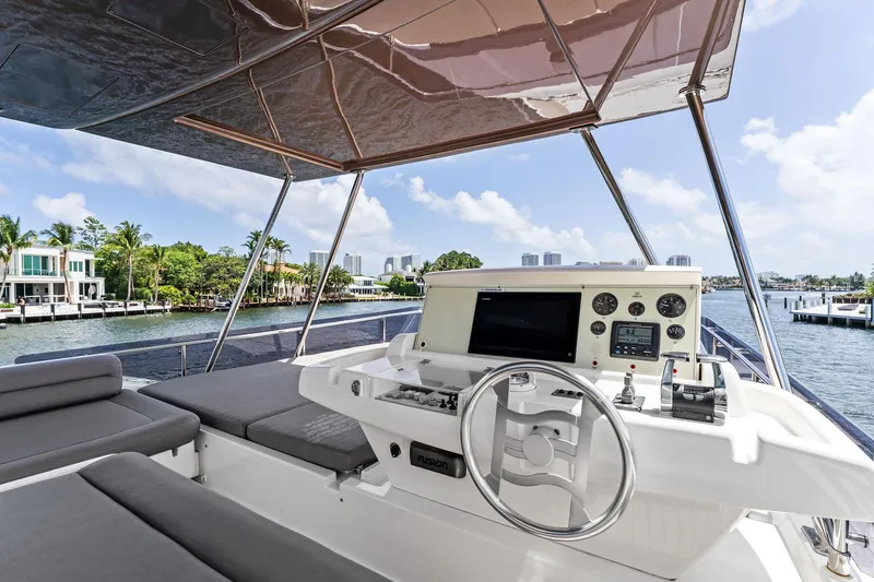 Blue Abalone Yacht Photos Pics Luxurious 2015 Ferretti Yachts 690 helm with waterfront view and modern controls.