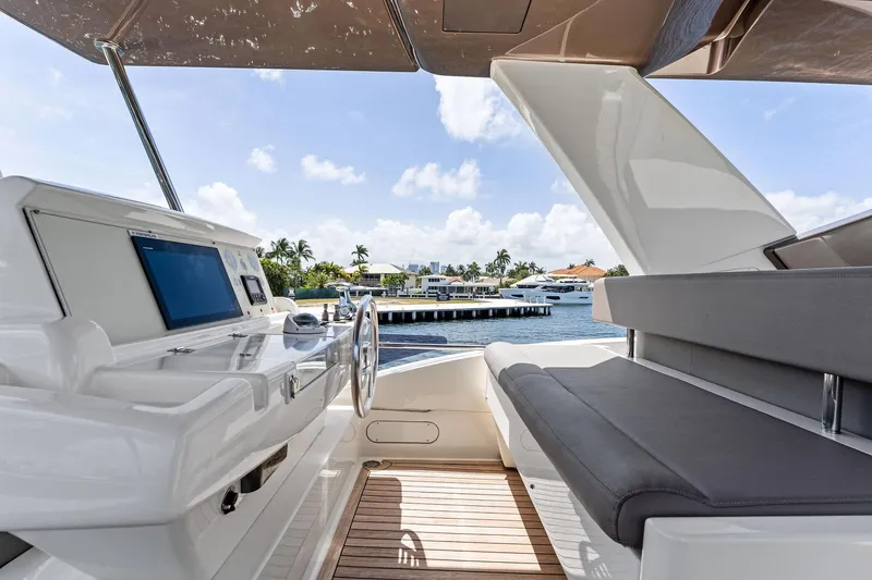 Blue Abalone Yacht Photos Pics Luxurious 2015 Ferretti Yachts 690 helm with modern controls and waterfront view.