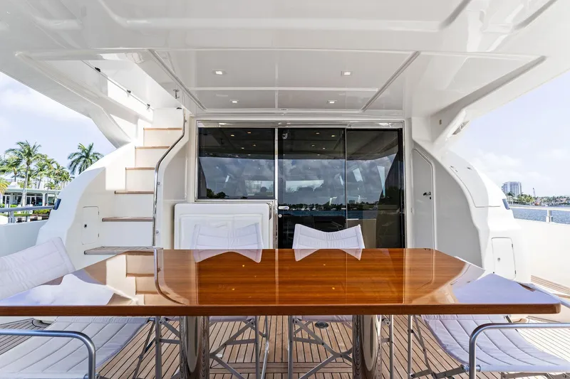 Blue Abalone Yacht Photos Pics Luxurious 2015 Ferretti Yachts 690 deck with elegant wooden table and modern seating.