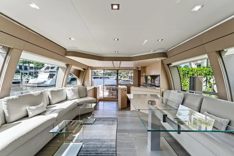 Blue Abalone Yacht Photos Pics Luxurious interior of 2015 Ferretti Yachts 690 with modern furnishings and large windows.