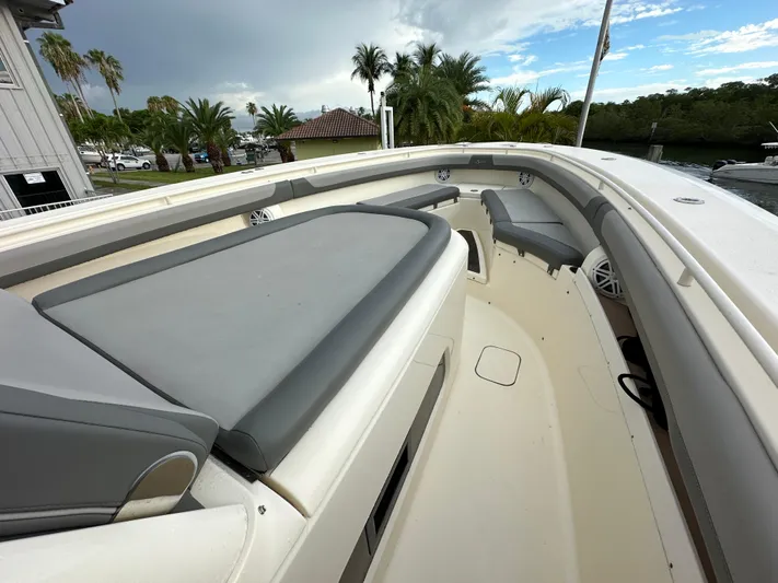  Yacht Photos Pics 2017 Scout 350 LXF boat interior with cushioned seating and sleek design.