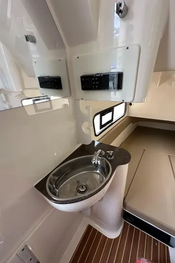  Yacht Photos Pics 2017 Scout 350 LXF boat interior with sink and seating area.